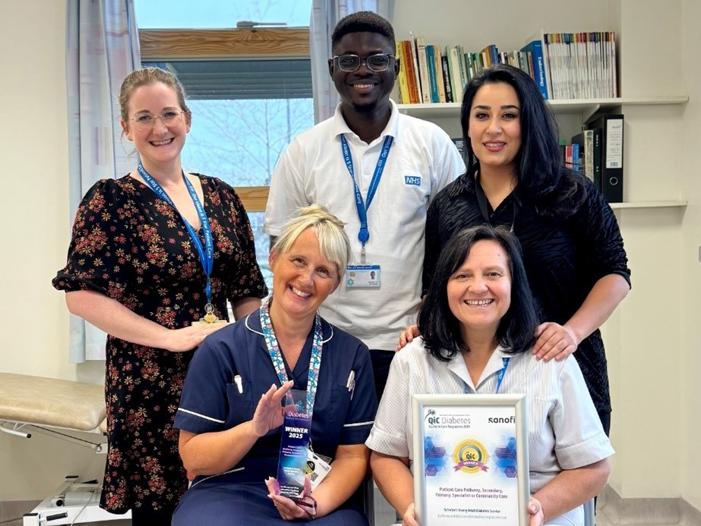 A group of people posing for a photo